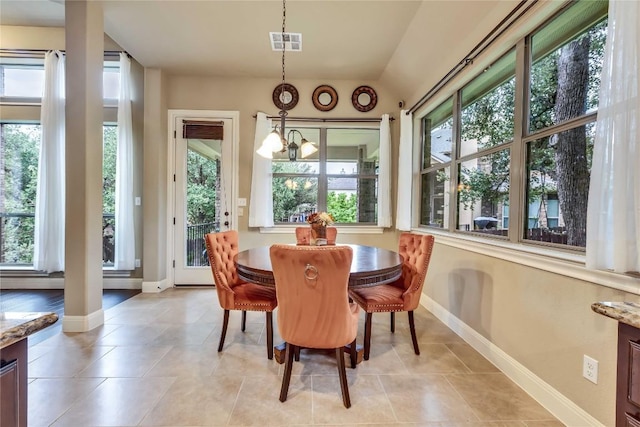 4108 Charbray Ct, Cedar Park, TX 78613 - dining space with plenty of natural light, light tile patterned floors, and a chandelier
