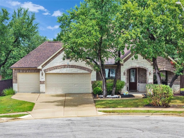 4108 Charbray Ct, Cedar Park, TX 78613 - view of front of home featuring concrete driveway, brick siding, an attached garage, stone siding, and a shingled roof