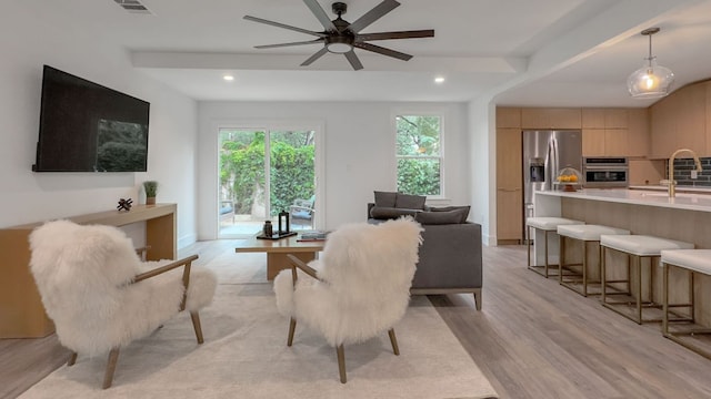 6709 Vine St, Austin, TX 78757 - living room with light wood-type flooring, ceiling fan, and recessed lighting