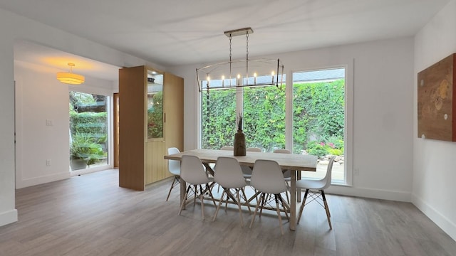 6709 Vine St, Austin, TX 78757 - dining space with wood finished floors and baseboards