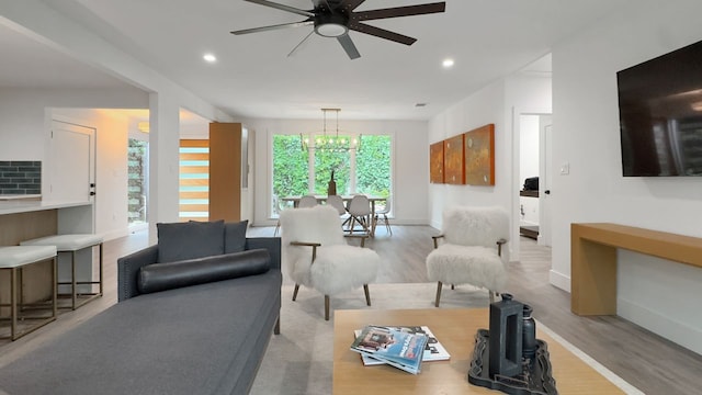 6709 Vine St, Austin, TX 78757 - living area with wood finished floors, ceiling fan, and recessed lighting