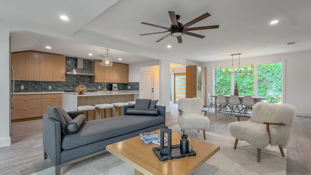6709 Vine St, Austin, TX 78757 - living room with light wood-style flooring, recessed lighting, and a ceiling fan
