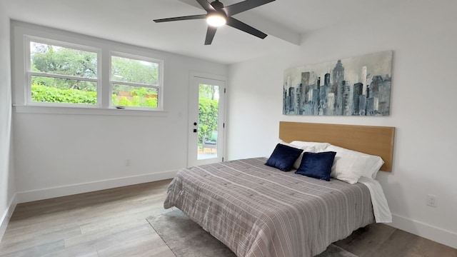 6709 Vine St, Austin, TX 78757 - bedroom with access to exterior, wood finished floors, and a ceiling fan