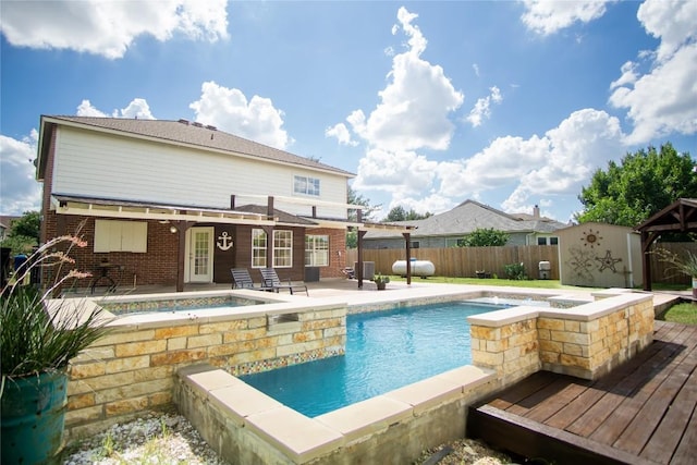 1112 Statler Bend Dr, Pflugerville, TX 78660 - view of swimming pool with an in-ground hot tub, a fenced backyard, and a deck