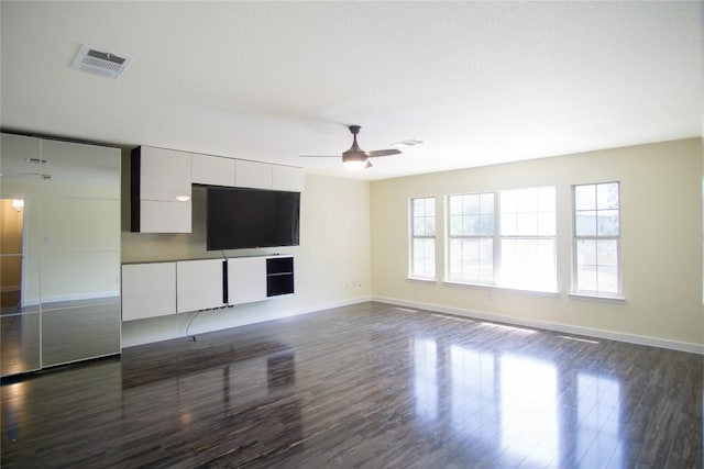 1112 Statler Bend Dr, Pflugerville, TX 78660 - unfurnished living room with dark wood-style floors and ceiling fan
