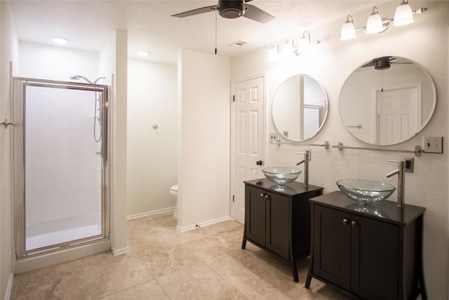 1112 Statler Bend Dr, Pflugerville, TX 78660 - full bathroom with ceiling fan, a stall shower, and two vanities