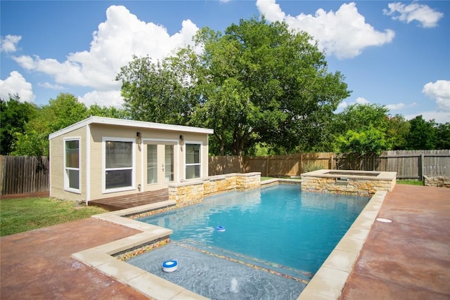 1112 Statler Bend Dr, Pflugerville, TX 78660 - view of swimming pool featuring a storage structure, an outbuilding, a fenced backyard, a pool with connected hot tub, and a patio