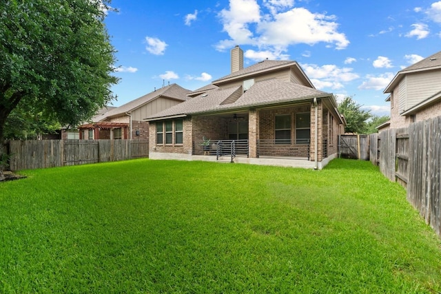4013 Gloucester Dr, Cedar Park, TX 78613 - rear view of house with brick siding, a chimney, a fenced backyard, and roof with shingles