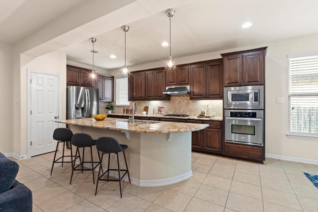 4013 Gloucester Dr, Cedar Park, TX 78613 - kitchen featuring appliances with stainless steel finishes, tasteful backsplash, light tile patterned floors, dark brown cabinetry, and recessed lighting