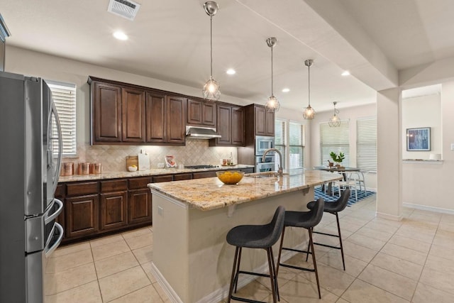 4013 Gloucester Dr, Cedar Park, TX 78613 - kitchen with stainless steel appliances, tasteful backsplash, plenty of natural light, light stone countertops, and recessed lighting