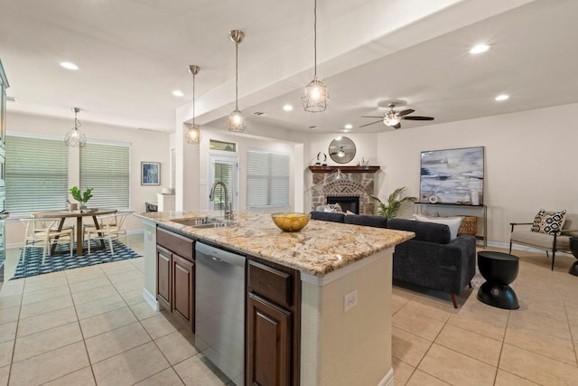 4013 Gloucester Dr, Cedar Park, TX 78613 - kitchen with dishwasher, light tile patterned flooring, a fireplace, recessed lighting, and ceiling fan