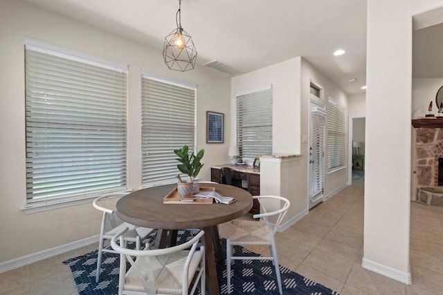 4013 Gloucester Dr, Cedar Park, TX 78613 - dining room featuring light tile patterned flooring, a fireplace, and recessed lighting