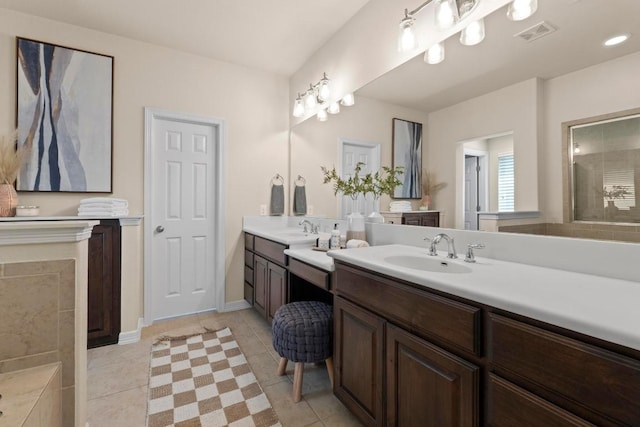 4013 Gloucester Dr, Cedar Park, TX 78613 - full bathroom featuring two vanities and tile patterned flooring