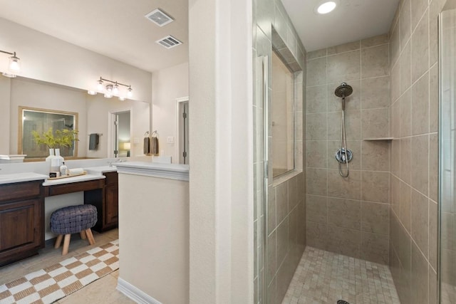 4013 Gloucester Dr, Cedar Park, TX 78613 - bathroom with tiled shower, vanity, tile patterned floors, and recessed lighting