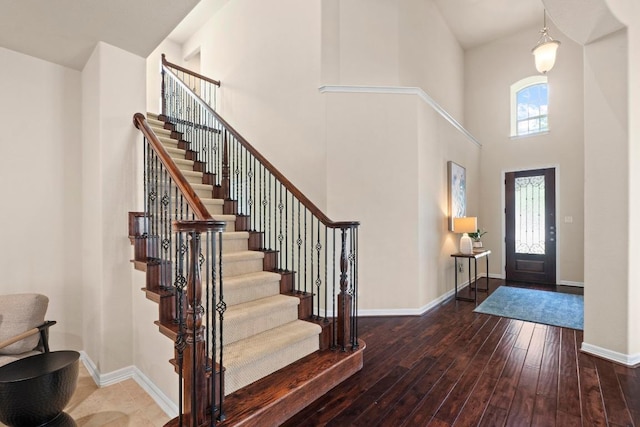 4013 Gloucester Dr, Cedar Park, TX 78613 - foyer featuring a towering ceiling, hardwood / wood-style floors, and stairs