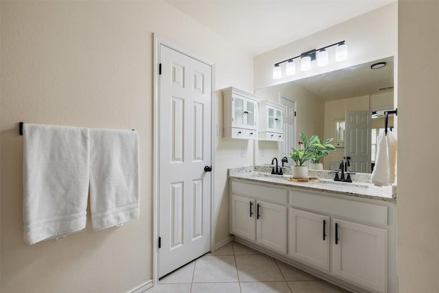 2519 Gate Ridge Dr, Austin, TX 78748 - bathroom featuring double vanity and tile patterned floors