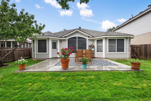 2519 Gate Ridge Dr, Austin, TX 78748 - rear view of property featuring a patio area, a fenced backyard, and a shingled roof