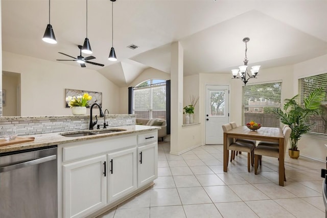 2519 Gate Ridge Dr, Austin, TX 78748 - kitchen featuring dishwasher, lofted ceiling, tasteful backsplash, a chandelier, and light stone countertops