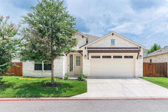 3805 Wales Ct Unit 611, Round Rock, TX 78681 - view of front of property featuring a garage, stone siding, and driveway