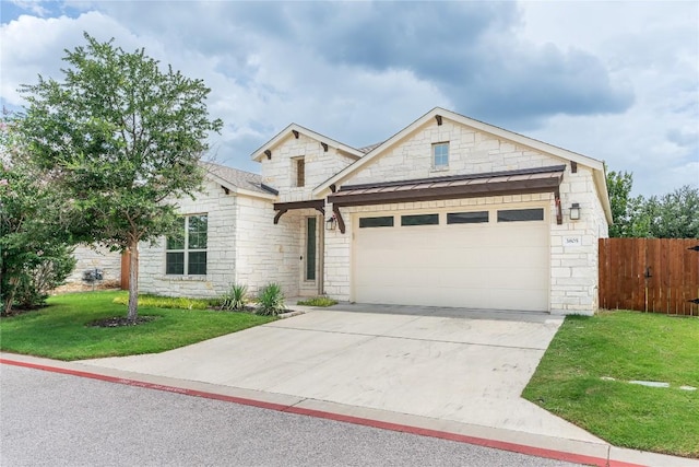 3805 Wales Ct Unit 611, Round Rock, TX 78681 - view of front facade featuring stone siding, an attached garage, driveway, and a standing seam roof