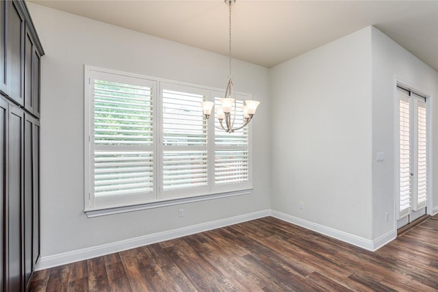 3805 Wales Ct Unit 611, Round Rock, TX 78681 - unfurnished dining area featuring a chandelier and dark wood-style floors