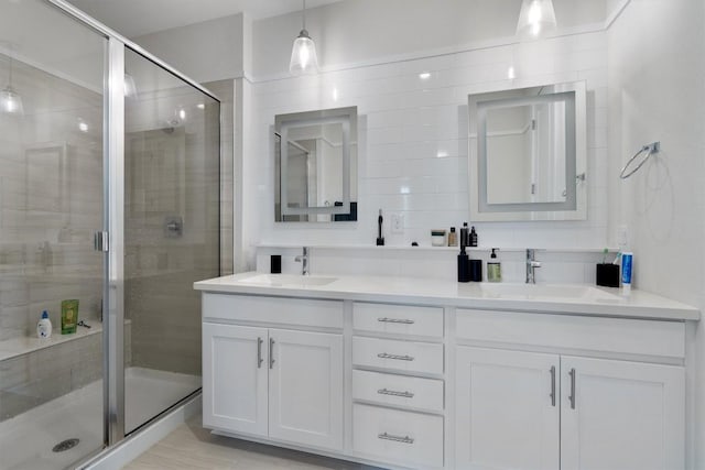12001 Vista Parke Dr Unit 406, Austin, TX 78726 - full bathroom featuring double vanity and a stall shower