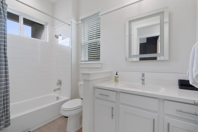 12001 Vista Parke Dr Unit 406, Austin, TX 78726 - full bathroom with vanity, shower / bath combo with shower curtain, and wood finished floors