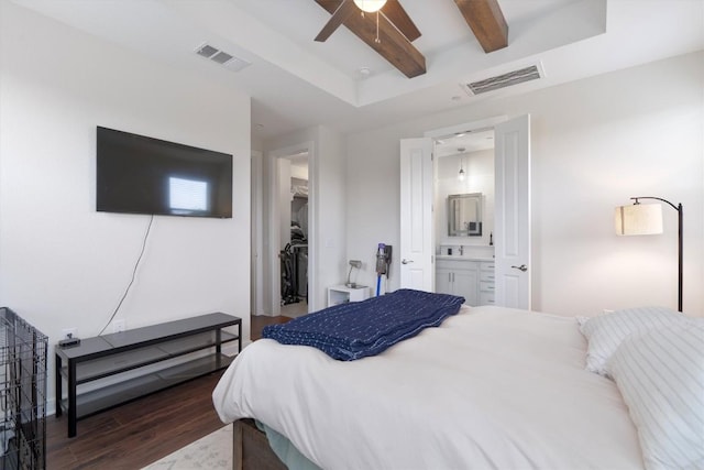 12001 Vista Parke Dr Unit 406, Austin, TX 78726 - bedroom featuring wood finished floors, beam ceiling, a walk in closet, connected bathroom, and ceiling fan