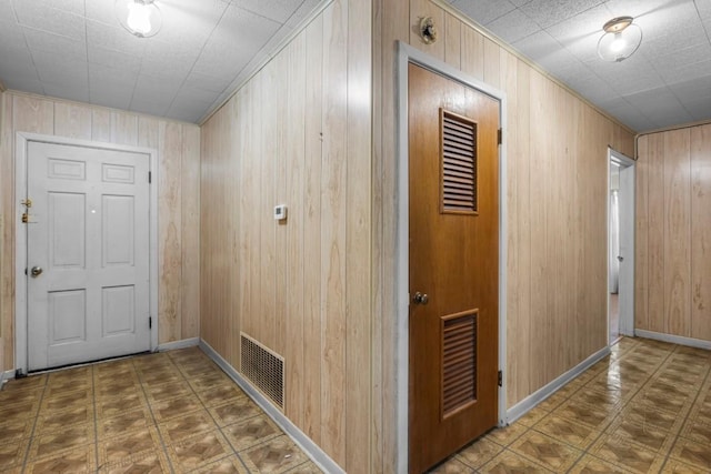1213 Norbert St, Marlin, TX 76661 - corridor featuring wooden walls and tile patterned floors