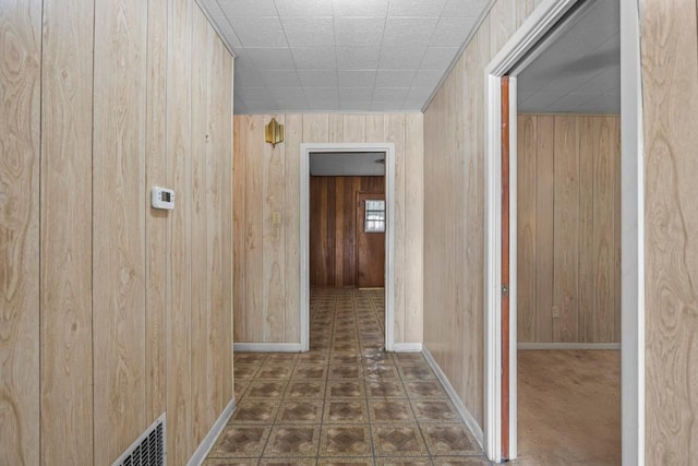 1213 Norbert St, Marlin, TX 76661 - corridor featuring wood walls