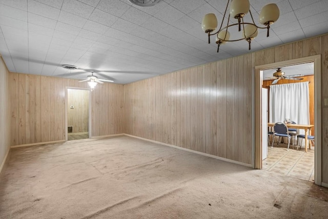 1213 Norbert St, Marlin, TX 76661 - unfurnished room featuring carpet floors, a chandelier, wooden walls, and ceiling fan