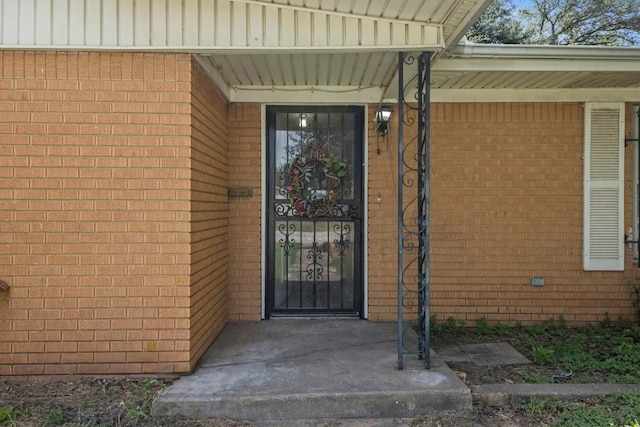 1213 Norbert St, Marlin, TX 76661 - view of exterior entry featuring brick siding