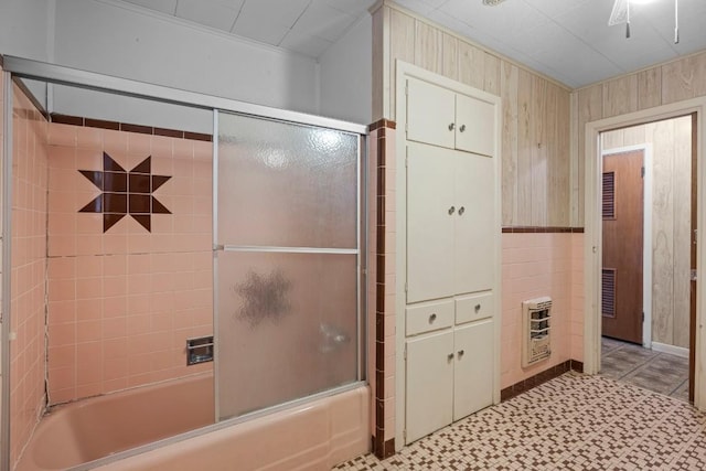1213 Norbert St, Marlin, TX 76661 - full bath with heating unit, combined bath / shower with glass door, wood walls, and tile patterned floors