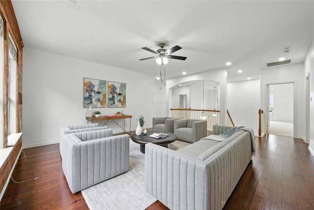 5704 Keli Ct, Austin, TX 78735 - living room featuring arched walkways, ceiling fan, dark wood-style flooring, and recessed lighting