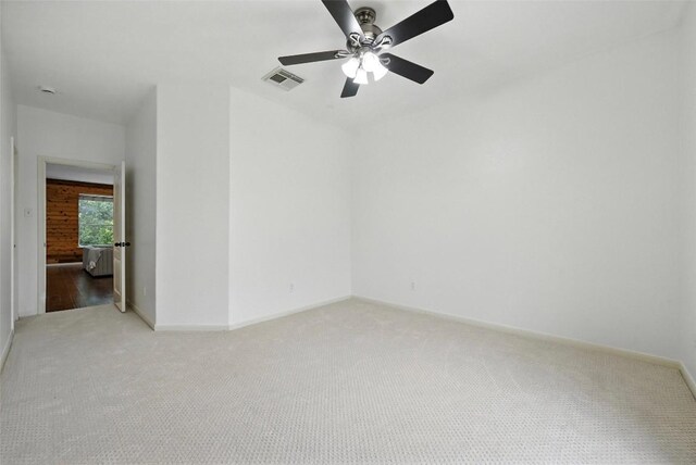 5704 Keli Ct, Austin, TX 78735 - empty room featuring light carpet, ceiling fan, and a smoke detector