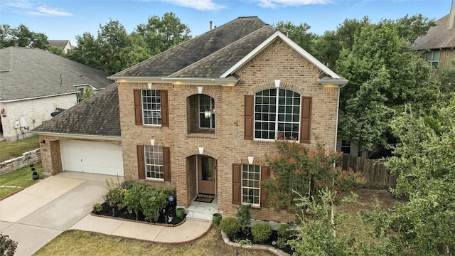 5704 Keli Ct, Austin, TX 78735 - view of front of home featuring brick siding, a garage, and concrete driveway
