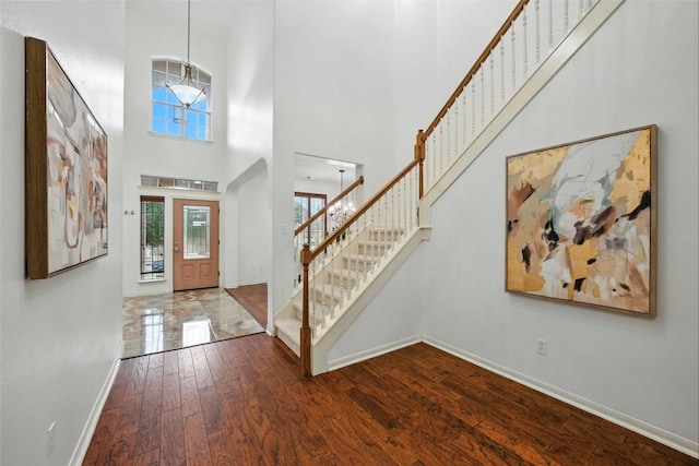 5704 Keli Ct, Austin, TX 78735 - entrance foyer with a towering ceiling, plenty of natural light, wood finished floors, and stairway
