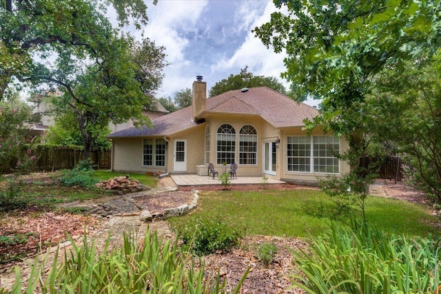 6604 Donner Cv, Austin, TX 78749 - back of house with a chimney and a patio area