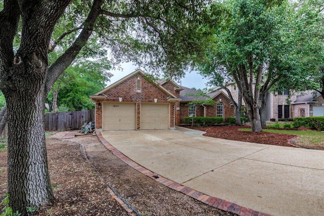 6604 Donner Cv, Austin, TX 78749 - view of front of house with brick siding, concrete driveway, and an attached garage