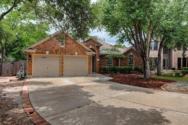 6604 Donner Cv, Austin, TX 78749 - view of front of property featuring driveway, an attached garage, and brick siding