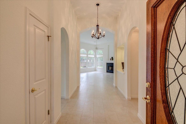 6604 Donner Cv, Austin, TX 78749 - hall featuring a chandelier and arched walkways
