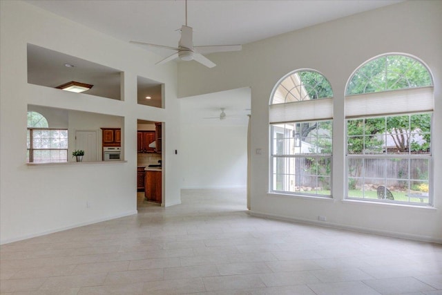 6604 Donner Cv, Austin, TX 78749 - unfurnished living room with ceiling fan and a towering ceiling