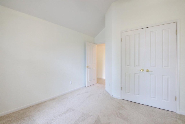 6604 Donner Cv, Austin, TX 78749 - unfurnished bedroom with light carpet, lofted ceiling, and a closet