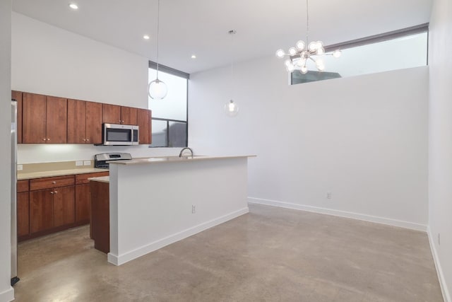 5912 Toscana Ave, Austin, TX 78724 - kitchen with stainless steel microwave, range, finished concrete flooring, brown cabinetry, and light countertops