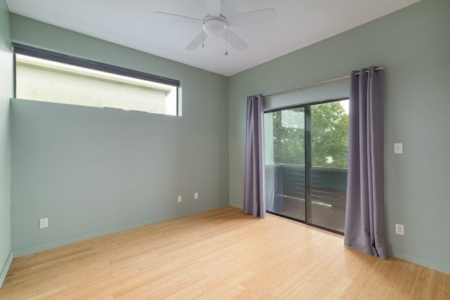 5912 Toscana Ave, Austin, TX 78724 - empty room featuring plenty of natural light, wood finished floors, and a ceiling fan