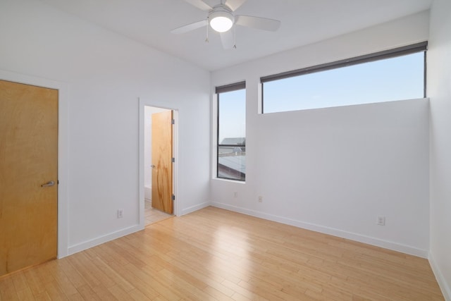 5912 Toscana Ave, Austin, TX 78724 - unfurnished bedroom featuring light wood-style floors, ceiling fan, and connected bathroom