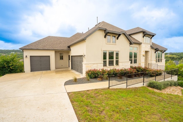 2220 Normandy Vw, Leander, TX 78641 - french country style house with an attached garage, stone siding, stucco siding, concrete driveway, and a shingled roof