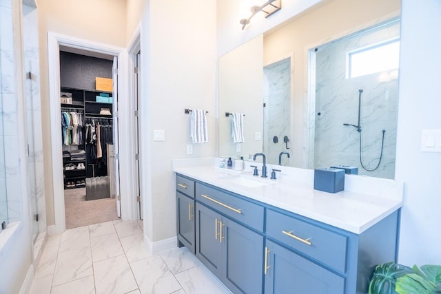 2220 Normandy Vw, Leander, TX 78641 - full bathroom with marble finish flooring, vanity, a marble finish shower, and a walk in closet