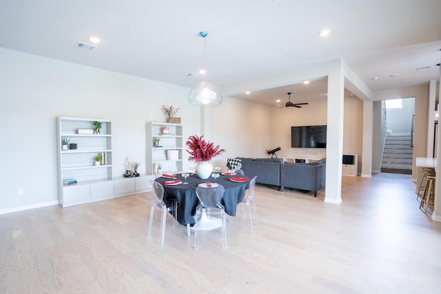 2220 Normandy Vw, Leander, TX 78641 - dining room with light wood-style flooring, stairway, a ceiling fan, and recessed lighting