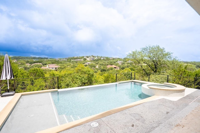2220 Normandy Vw, Leander, TX 78641 - view of pool with a pool with connected hot tub and a wooded view